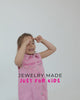 Girls playing while wearing hypoallergenic sterling silver children's jewelry from In Season Jewelry